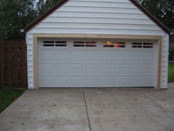 After garage door repair featuring a modern, insulated garage door in Buffalo, NY.